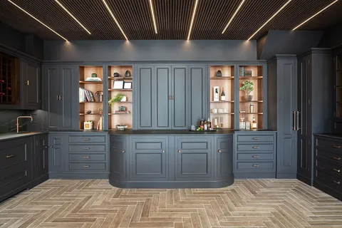 Navy cabinetry with lit display shelves